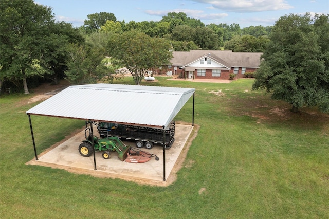 416 State Highway 21 E, Crockett, TX 75835 - view of green lawn with a carport and an outbuilding