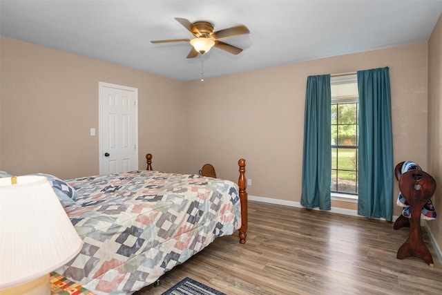 416 State Highway 21 E, Crockett, TX 75835 - bedroom with wood finished floors, baseboards, and a ceiling fan