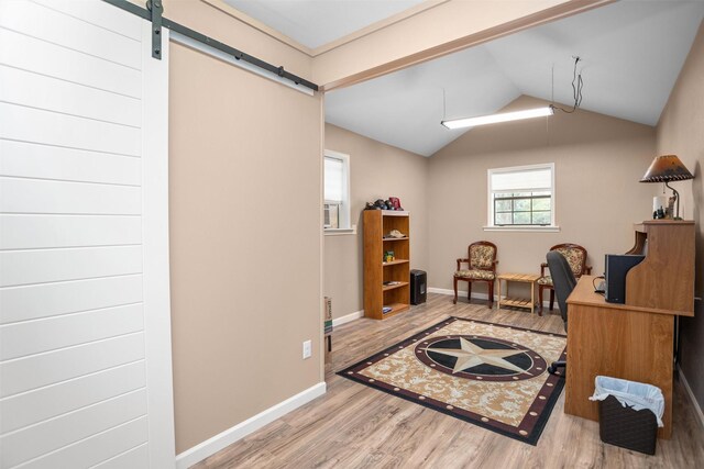 416 State Highway 21 E, Crockett, TX 75835 - office space featuring wood finished floors, baseboards, vaulted ceiling, and a barn door