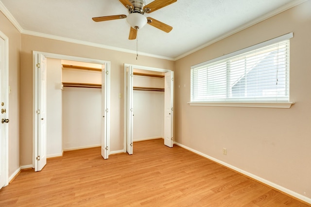 333 Banyan Dr, Lake Jackson, TX 77566 - unfurnished bedroom featuring multiple closets, light wood-type flooring, ornamental molding, baseboards, and a ceiling fan