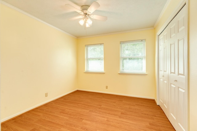 333 Banyan Dr, Lake Jackson, TX 77566 - unfurnished bedroom with light wood finished floors, ornamental molding, a closet, baseboards, and a ceiling fan