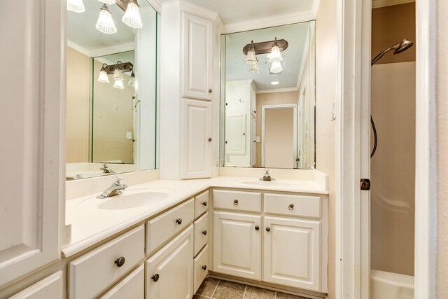 333 Banyan Dr, Lake Jackson, TX 77566 - bathroom featuring double vanity, ornamental molding, and a shower