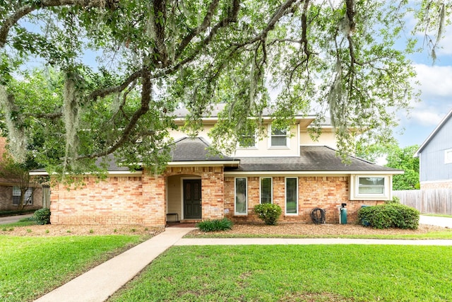 333 Banyan Dr, Lake Jackson, TX 77566 - view of front of house featuring brick siding and a shingled roof