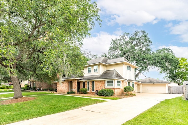 333 Banyan Dr, Lake Jackson, TX 77566 - traditional-style home with concrete driveway, brick siding, and a garage
