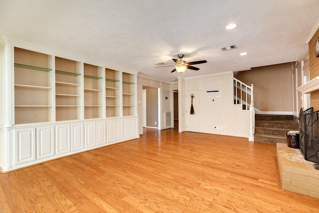 333 Banyan Dr, Lake Jackson, TX 77566 - unfurnished living room with light wood finished floors, stairs, a ceiling fan, and recessed lighting
