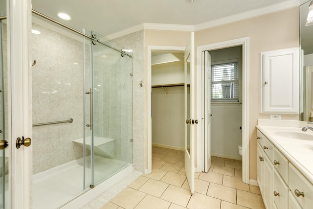 333 Banyan Dr, Lake Jackson, TX 77566 - full bath with crown molding, a stall shower, toilet, vanity, and a spacious closet