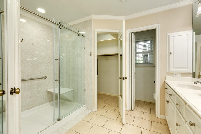 333 Banyan Dr, Lake Jackson, TX 77566 - bathroom featuring ornamental molding, a stall shower, toilet, vanity, and a spacious closet