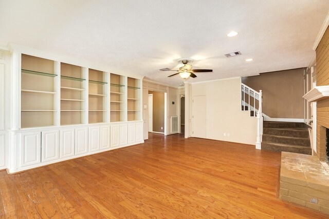 333 Banyan Dr, Lake Jackson, TX 77566 - unfurnished living room featuring wood finished floors, stairway, a ceiling fan, recessed lighting, and crown molding