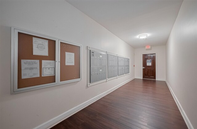 4515 Briar Hollow Pl Unit 307, Houston, TX 77027 - hall with wood finished floors, mail area, and baseboards