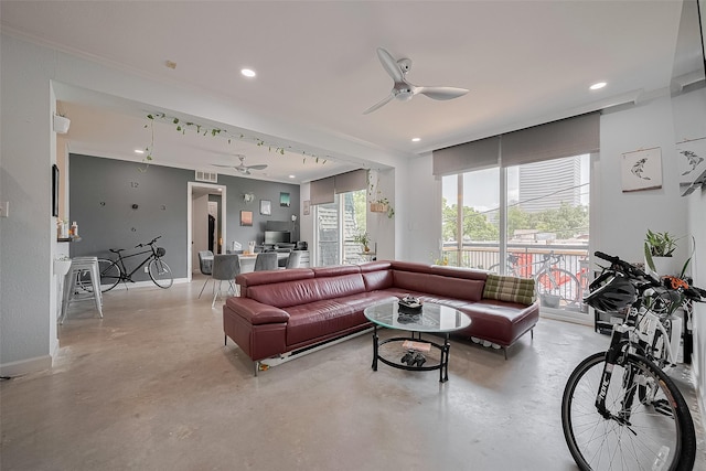 4515 Briar Hollow Pl Unit 307, Houston, TX 77027 - living area with concrete floors, a ceiling fan, crown molding, baseboards, and recessed lighting