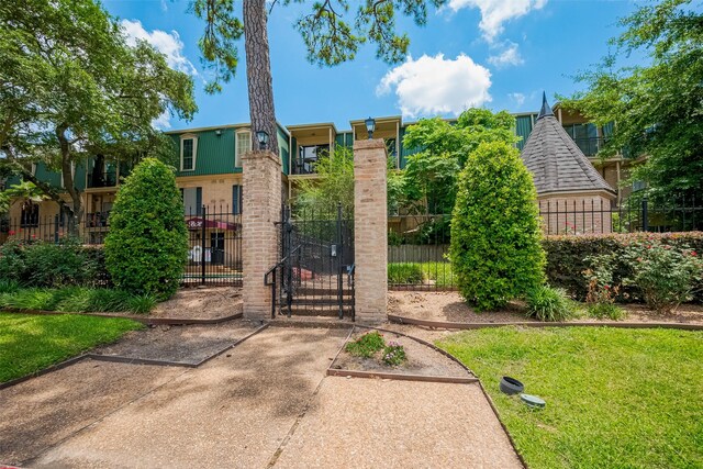 4515 Briar Hollow Pl Unit 307, Houston, TX 77027 - view of front of home featuring a gate