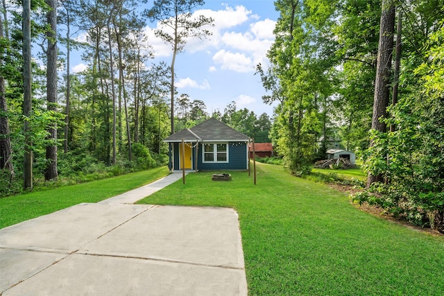 15229 Travis Ln, Willis, TX 77378 - view of front facade with a front yard