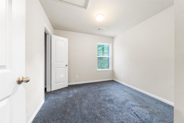 15229 Travis Ln, Willis, TX 77378 - empty room with dark carpet and baseboards