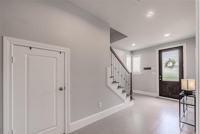 8670 Green Kolbe Ln, Houston, TX 77080 - entryway with baseboards, stairs, recessed lighting, and light tile patterned floors