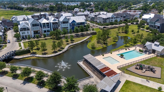 8670 Green Kolbe Ln, Houston, TX 77080 - aerial perspective of suburban area with a nearby body of water and a pool