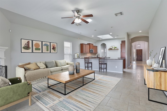 10014 Mahaffey Rd, Tomball, TX 77375 - living room featuring arched walkways, ceiling fan, and recessed lighting