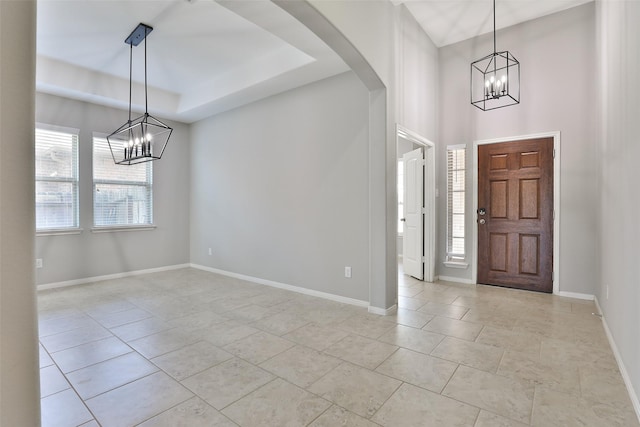 10014 Mahaffey Rd, Tomball, TX 77375 - foyer entrance with a chandelier, healthy amount of natural light, and light tile patterned flooring