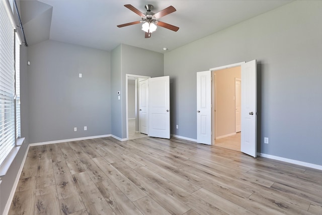 10014 Mahaffey Rd, Tomball, TX 77375 - unfurnished bedroom featuring light wood-type flooring, baseboards, and a ceiling fan