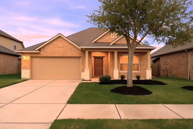 10014 Mahaffey Rd, Tomball, TX 77375 - view of front of property with an attached garage, concrete driveway, a front lawn, and brick siding