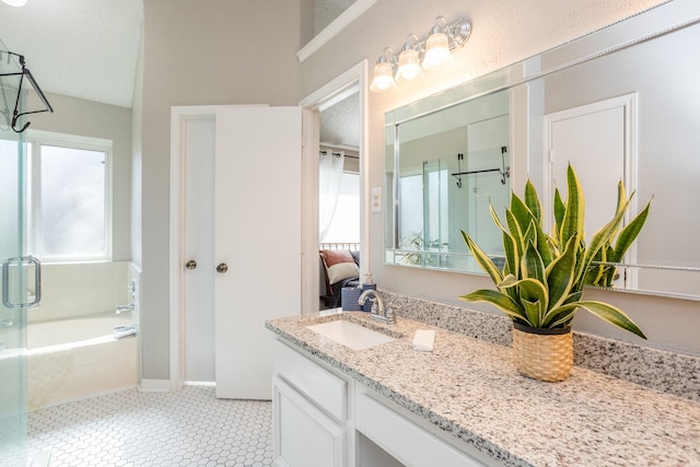 16014 Sweet Fern St, Houston, TX 77070 - ensuite bathroom with plenty of natural light, a bath, vanity, and tile patterned floors