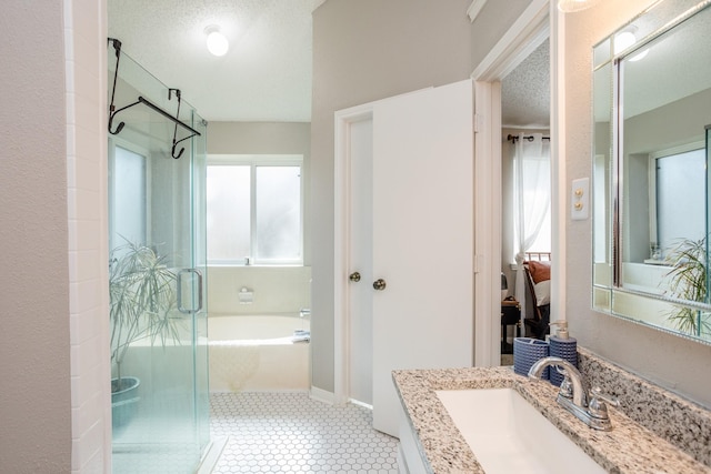 16014 Sweet Fern St, Houston, TX 77070 - full bathroom with a shower stall, a bath, vanity, and baseboards