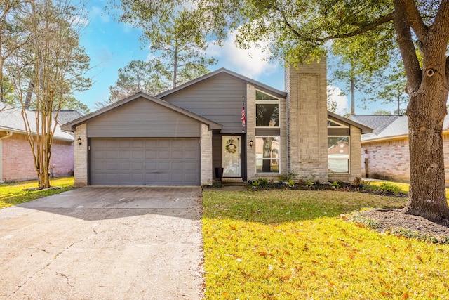 16014 Sweet Fern St, Houston, TX 77070 - mid-century modern home featuring concrete driveway, a garage, a front lawn, and brick siding