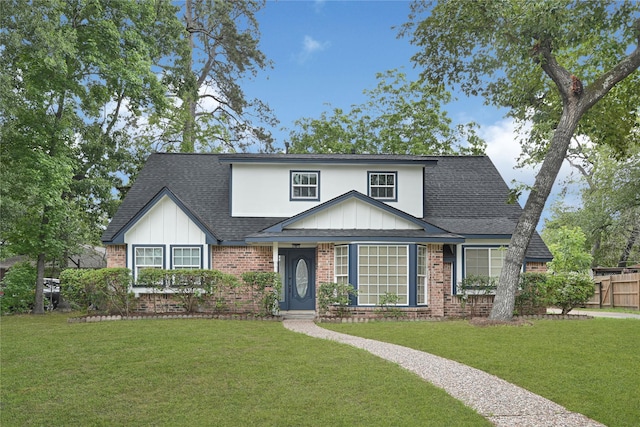 5815 Old Lodge Dr, Houston, TX 77066 - view of front of property featuring a shingled roof, brick siding, and board and batten siding