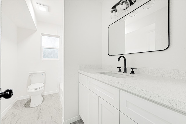 5815 Old Lodge Dr, Houston, TX 77066 - full bath with baseboards, marble finish flooring, toilet, and vanity