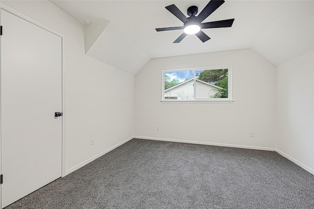 5815 Old Lodge Dr, Houston, TX 77066 - additional living space with dark carpet, lofted ceiling, a ceiling fan, and baseboards