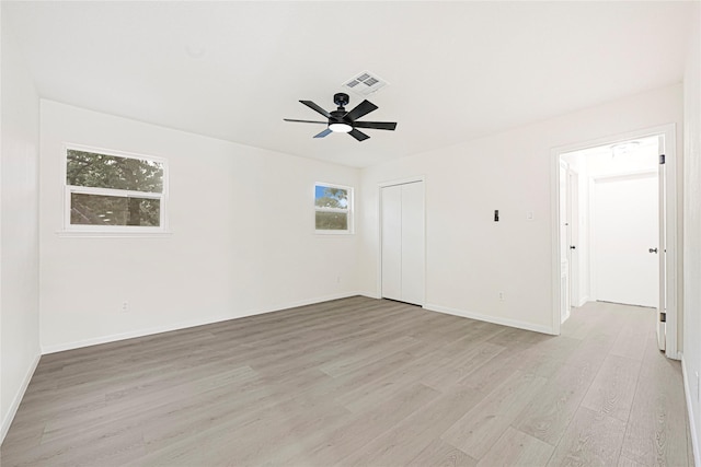 5815 Old Lodge Dr, Houston, TX 77066 - empty room with light wood-style floors, ceiling fan, and baseboards