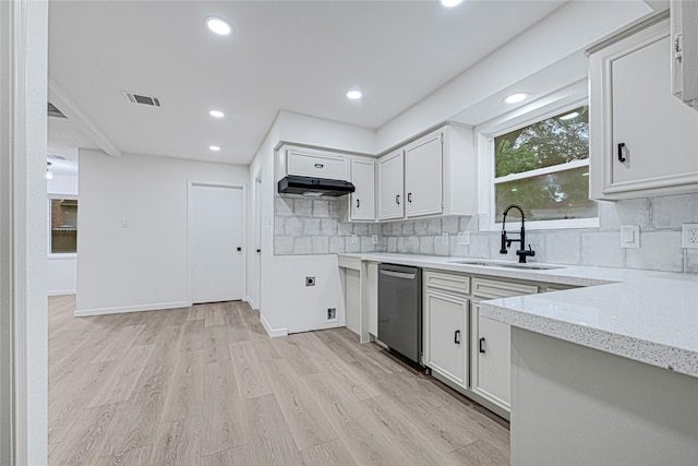 5815 Old Lodge Dr, Houston, TX 77066 - kitchen with dishwasher, a sink, decorative backsplash, under cabinet range hood, and light wood-style floors