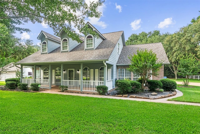 20103 Faye St, Tomball, TX 77377 - new england style home with a porch, roof with shingles, and a front yard