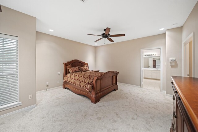 20103 Faye St, Tomball, TX 77377 - bedroom with light colored carpet, baseboards, recessed lighting, ensuite bathroom, and a ceiling fan