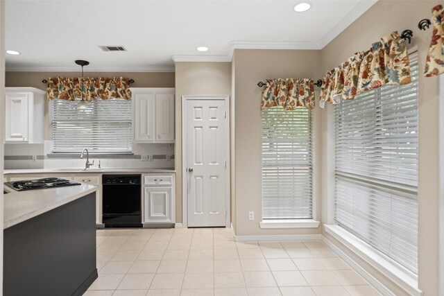20103 Faye St, Tomball, TX 77377 - kitchen featuring black appliances, a sink, light countertops, white cabinets, and tasteful backsplash