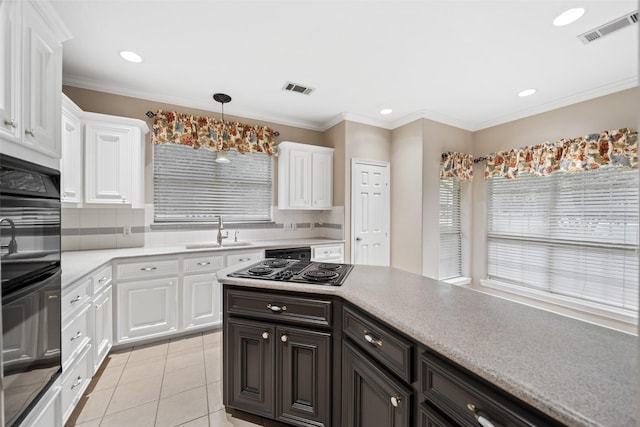 20103 Faye St, Tomball, TX 77377 - kitchen featuring a sink, black appliances, white cabinets, light countertops, and backsplash