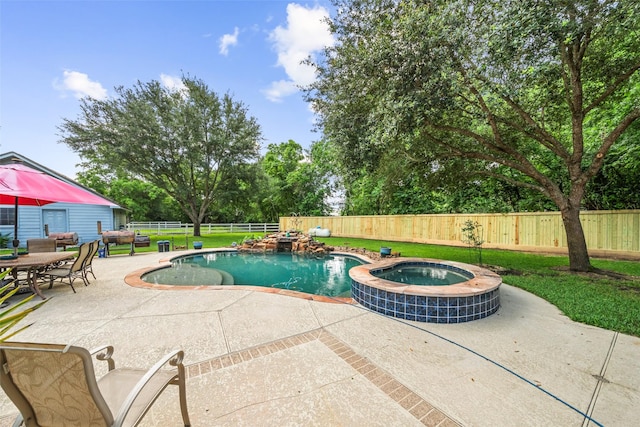 20103 Faye St, Tomball, TX 77377 - view of swimming pool with a patio and a pool with connected hot tub