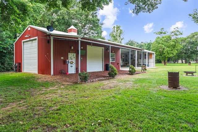 20103 Faye St, Tomball, TX 77377 - back of property with a yard, an outbuilding, and a garage