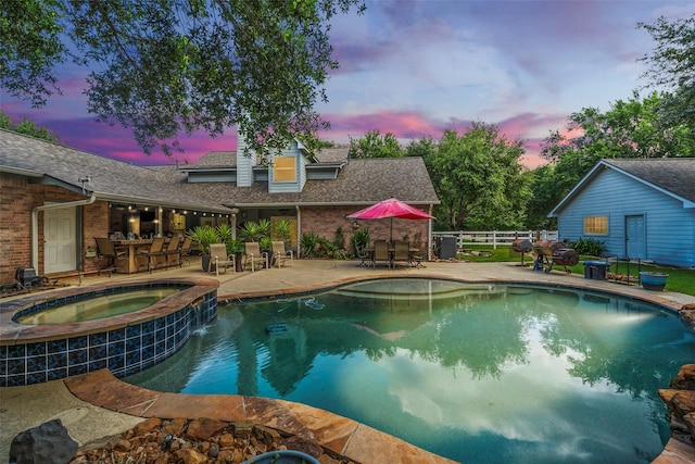 20103 Faye St, Tomball, TX 77377 - view of swimming pool with outdoor dining area, a patio, a pool with connected hot tub, and cooling unit