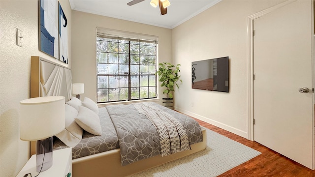 2121 El Paseo St Unit 1511, Houston, TX 77054 - bedroom with ornamental molding, wood finished floors, baseboards, and ceiling fan