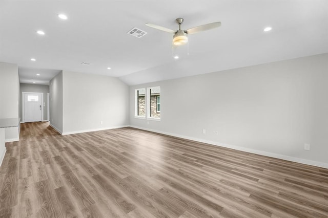 311 Emma St, Angleton, TX 77515 - unfurnished room with recessed lighting, baseboards, a ceiling fan, wood finished floors, and lofted ceiling