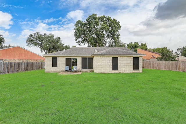 back of property featuring a patio area, brick siding, and a shingled roof