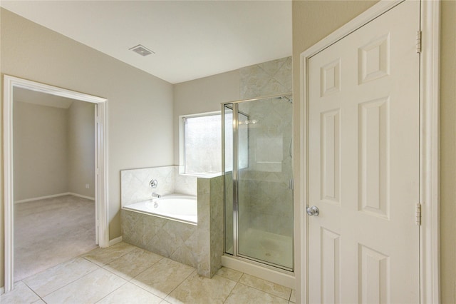 2831 Lake Villa Dr, Missouri City, TX 77459 - full bath with a shower stall, a garden tub, tile patterned flooring, and baseboards