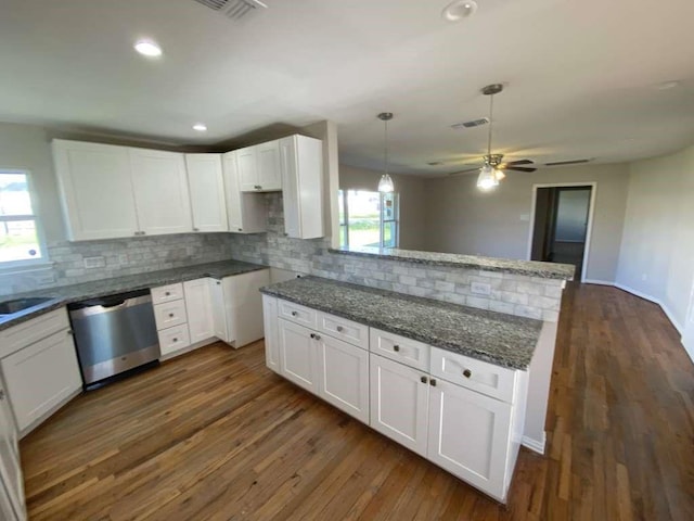 7209 La Salette St, Houston, TX 77021 - kitchen with dishwasher, tasteful backsplash, dark stone counters, white cabinets, and a ceiling fan