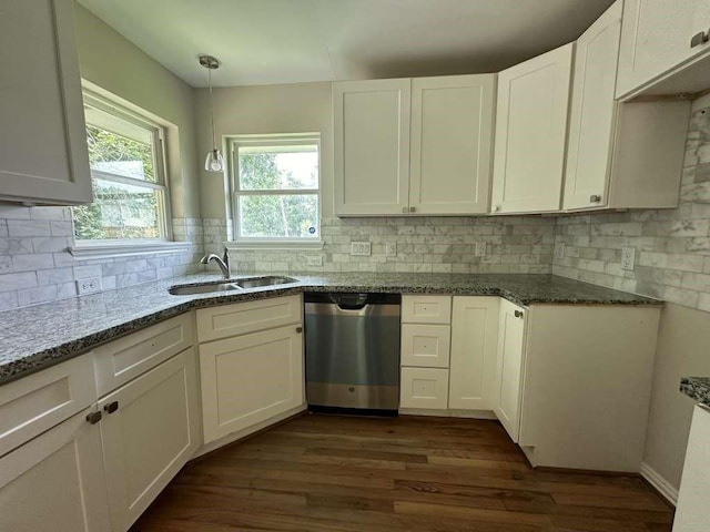 7209 La Salette St, Houston, TX 77021 - kitchen featuring stainless steel dishwasher, a sink, stone countertops, dark wood-style flooring, and white cabinets