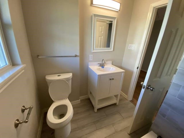 7209 La Salette St, Houston, TX 77021 - bathroom featuring toilet, vanity, tile patterned flooring, and baseboards