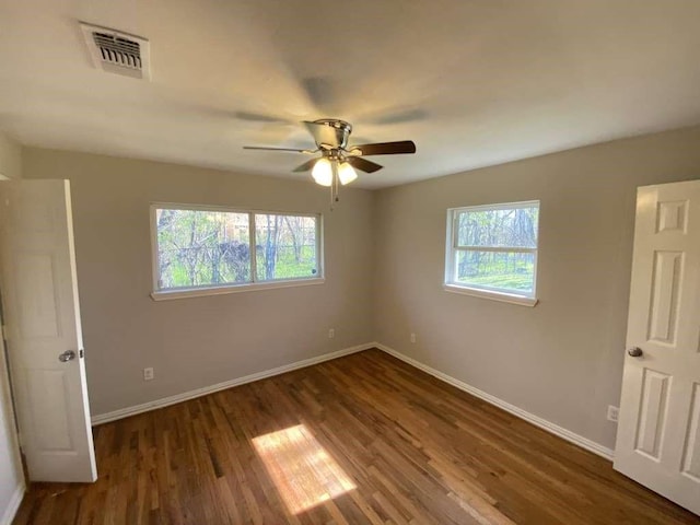 7209 La Salette St, Houston, TX 77021 - unfurnished bedroom featuring baseboards, wood finished floors, and a ceiling fan