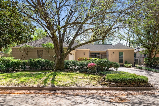 3114 Breezy Pines Ct, Kingwood, TX 77339 - single story home featuring brick siding and a garage