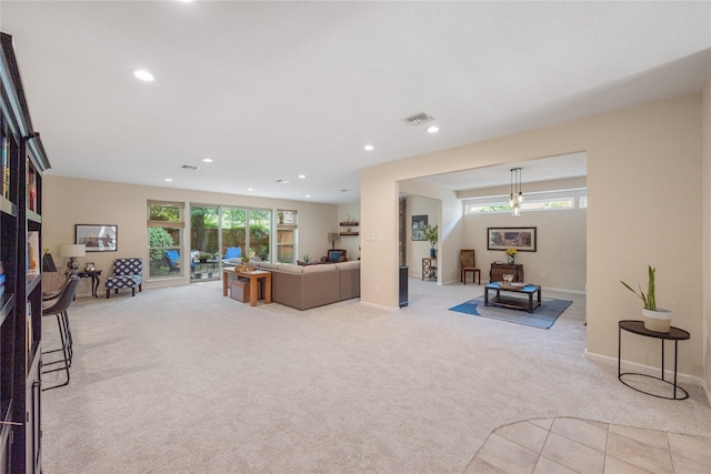 3114 Breezy Pines Ct, Kingwood, TX 77339 - living area featuring light carpet, recessed lighting, and baseboards