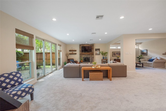 3114 Breezy Pines Ct, Kingwood, TX 77339 - living area featuring light colored carpet, recessed lighting, and a large fireplace