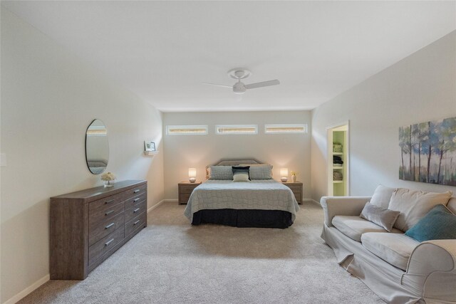 3114 Breezy Pines Ct, Kingwood, TX 77339 - bedroom with light colored carpet, ceiling fan, and baseboards